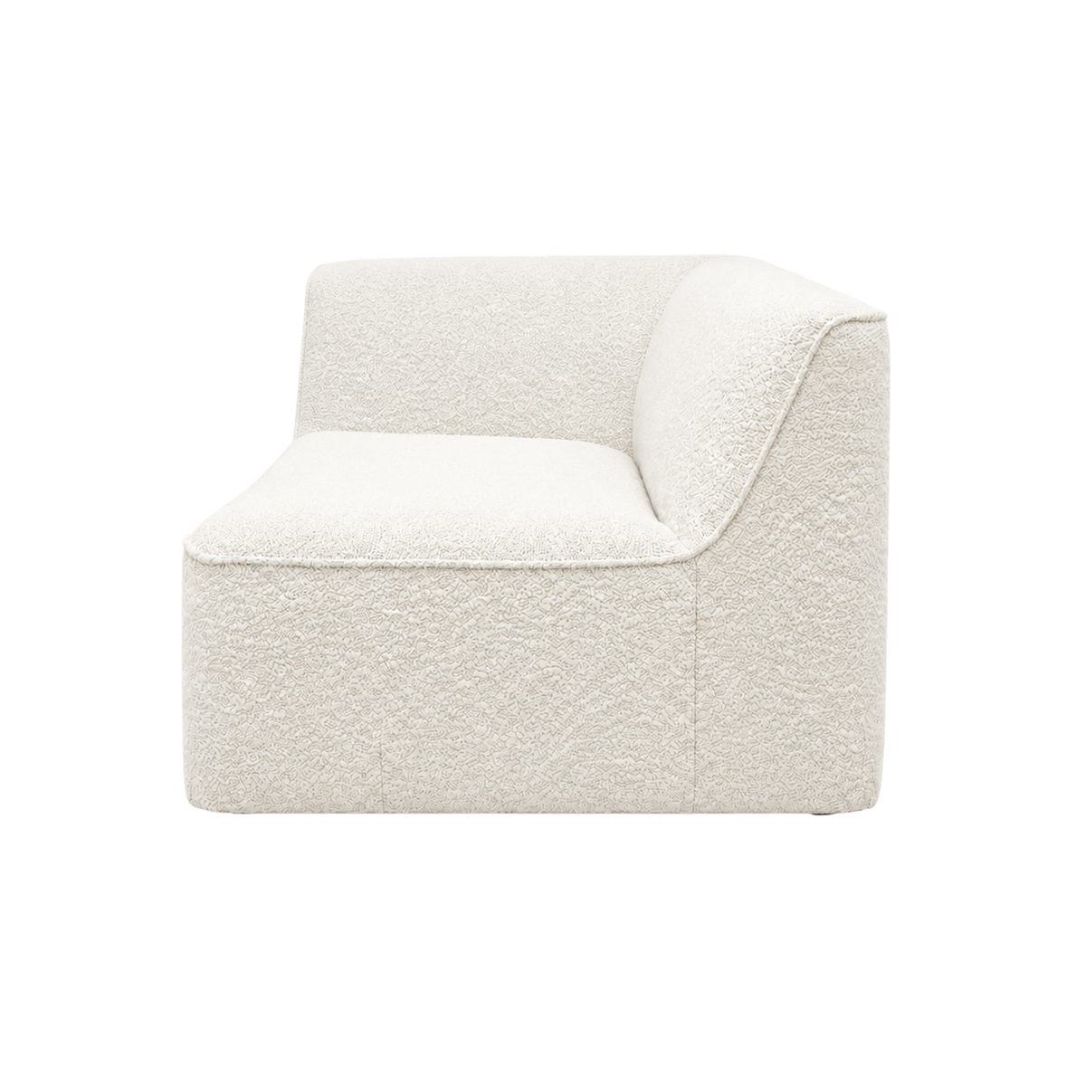 Bento Modular RAF Chair in ivory bouclé, angled side view showing the back sweeping down into a rounded right arm, a deep contoured seat and a fine piped edge.