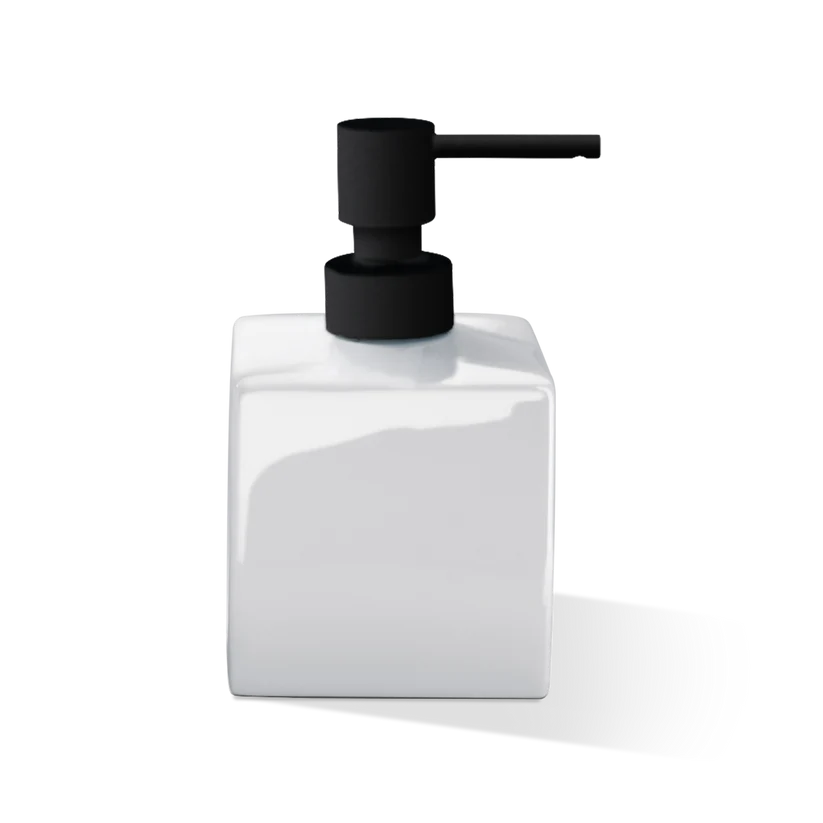 Porcelain Soap Dispenser shown from the front in white glossy porcelain, featuring a squared silhouette, matte black pump, and extended spout.
