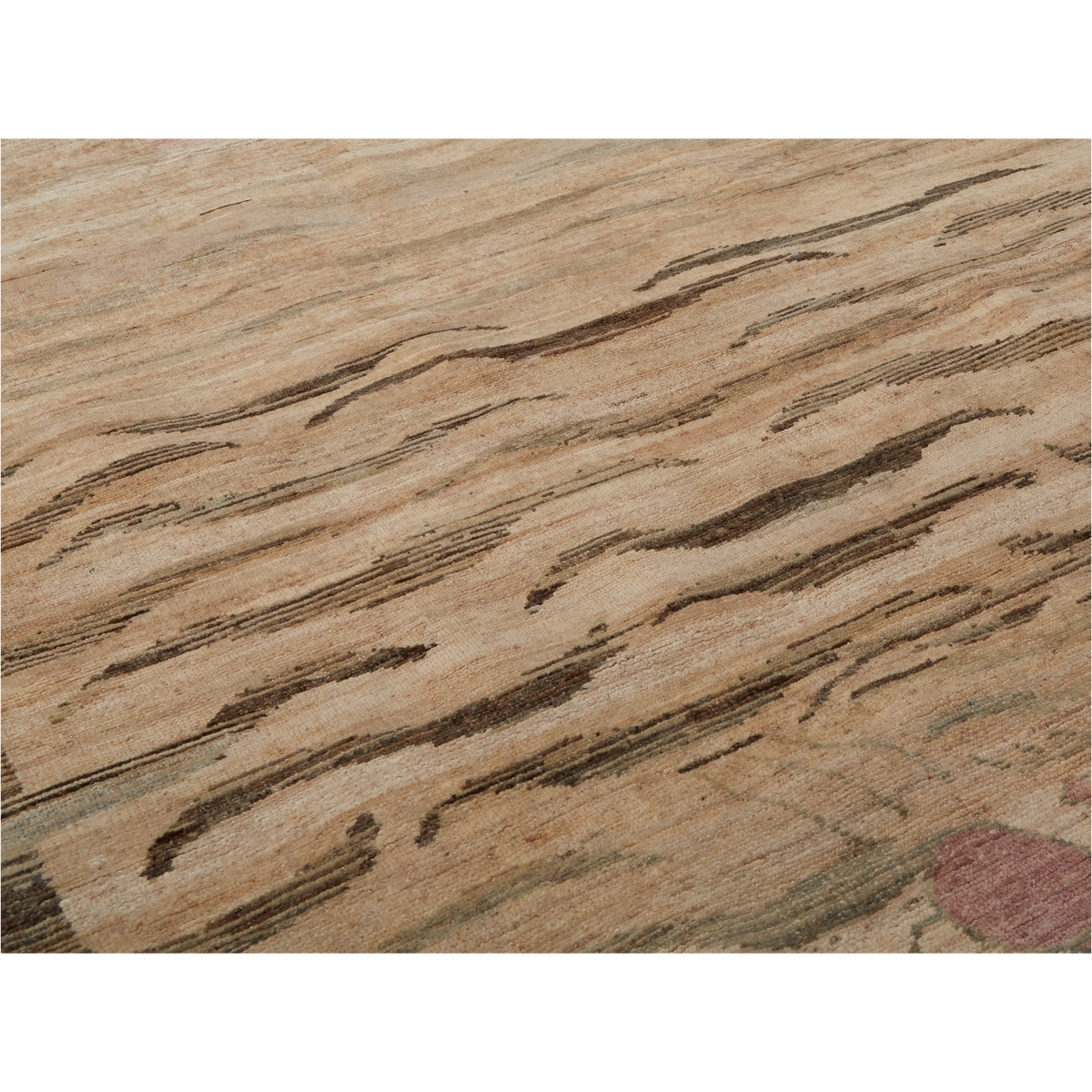 A close-up of a textured area rug featuring a natural wood grain pattern in shades of beige, brown, and tan.
