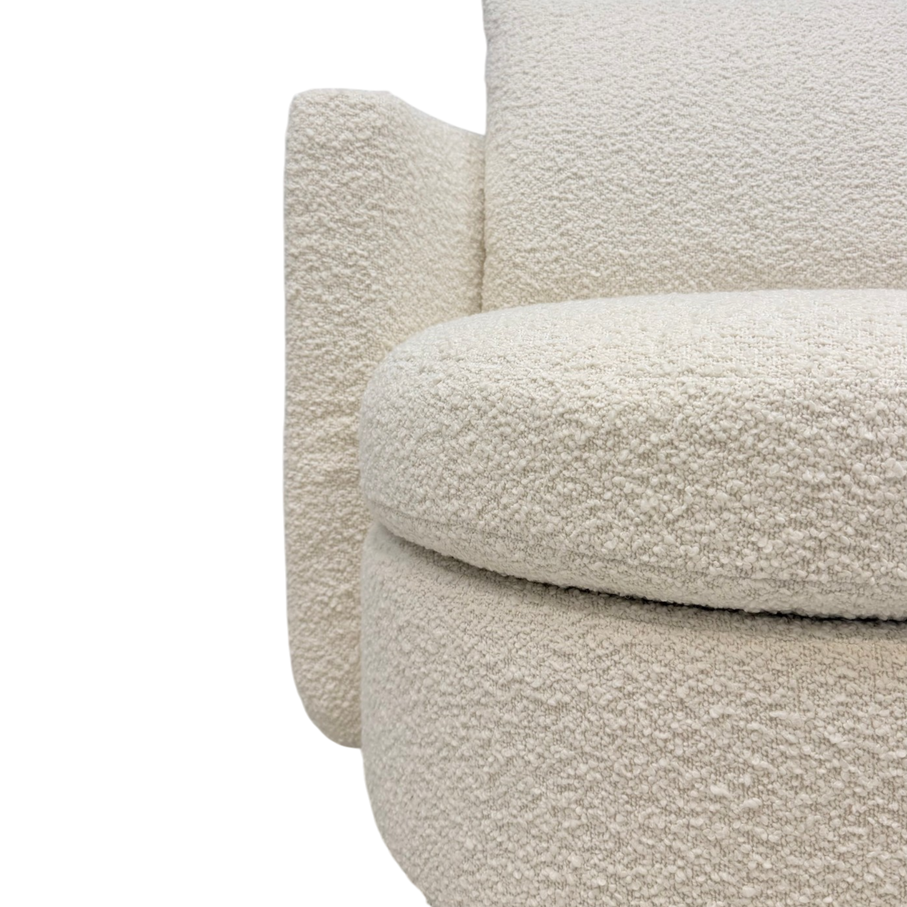Solenne Swivel Chair in Nat Oak ivory upholstery, angled front view showing the rounded seat, curved lumbar cushion, and wraparound sides.