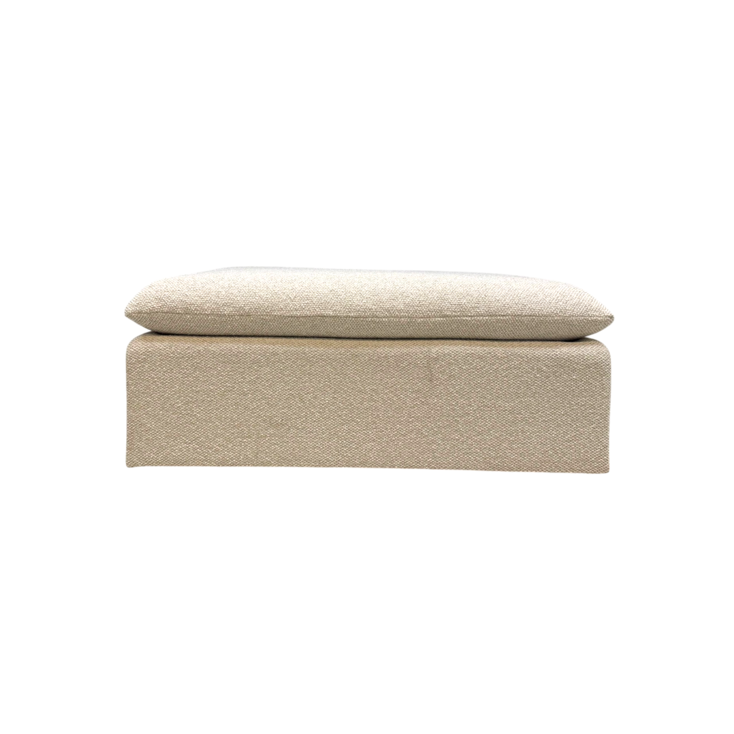 Tempo Modular Ottoman front view featuring a low-profile rectangular form, fully upholstered base, and oversized loose cushion in ivory textured fabric.