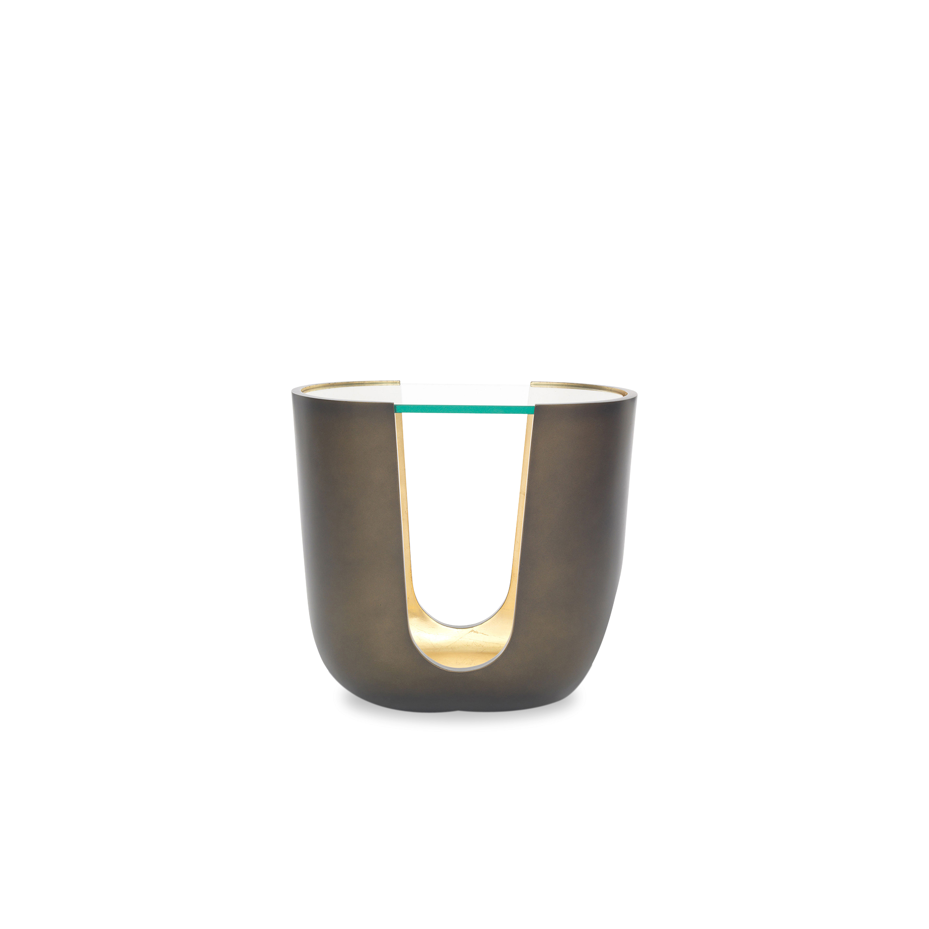 With its cut-out base and contrasting metallic interior, the Vessel Side Table strikes a luxurious note.