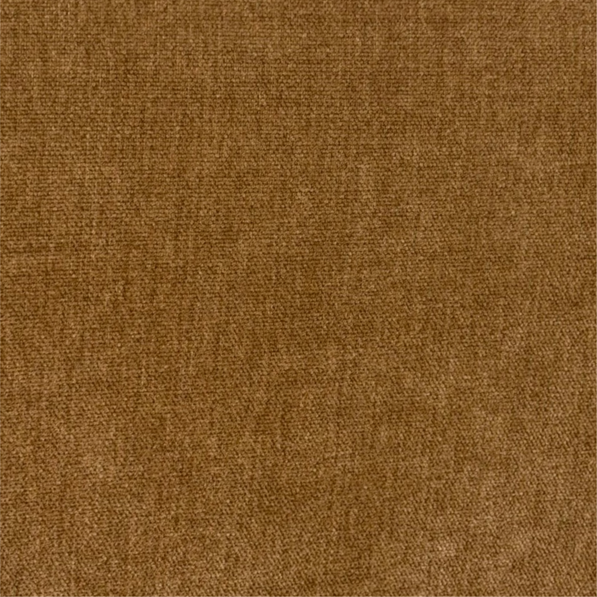 Close-up showing Caramel velvet upholstery with a fine, low pile and subtle tonal mottling.