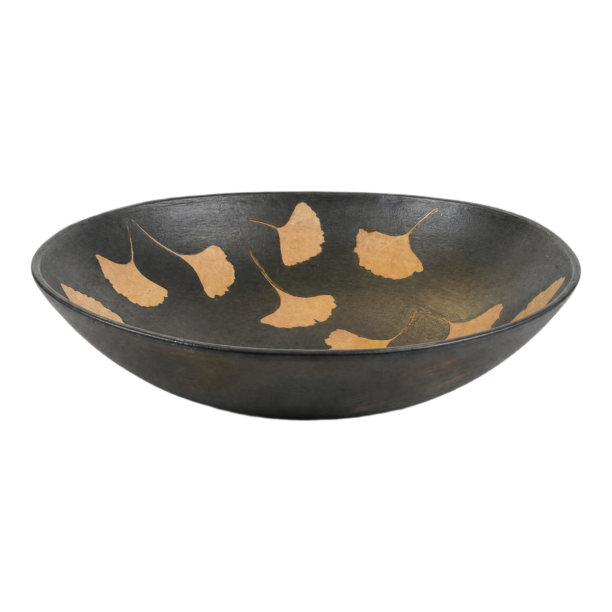 Ginko Ceramic Bowl side view showing its broad, gently curved matte black ceramic form with warm ochre ginkgo leaf motifs inside.