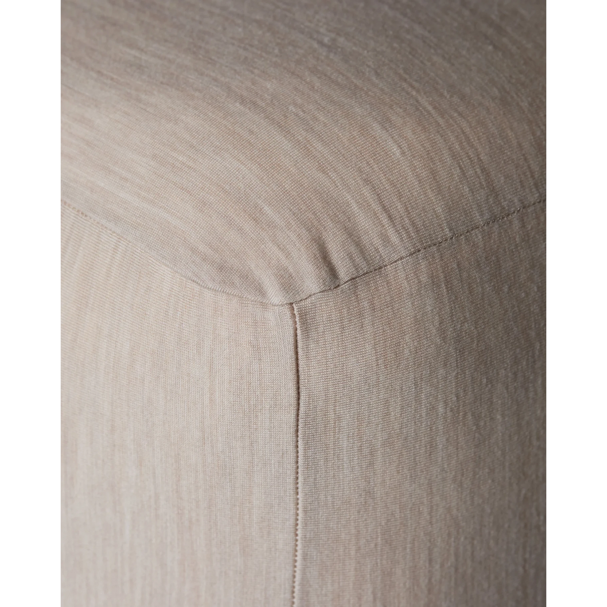 Close-up of Merino Fit Sheet King in Ivory showing the smooth jersey texture, fitted corner and tailored seam detail.