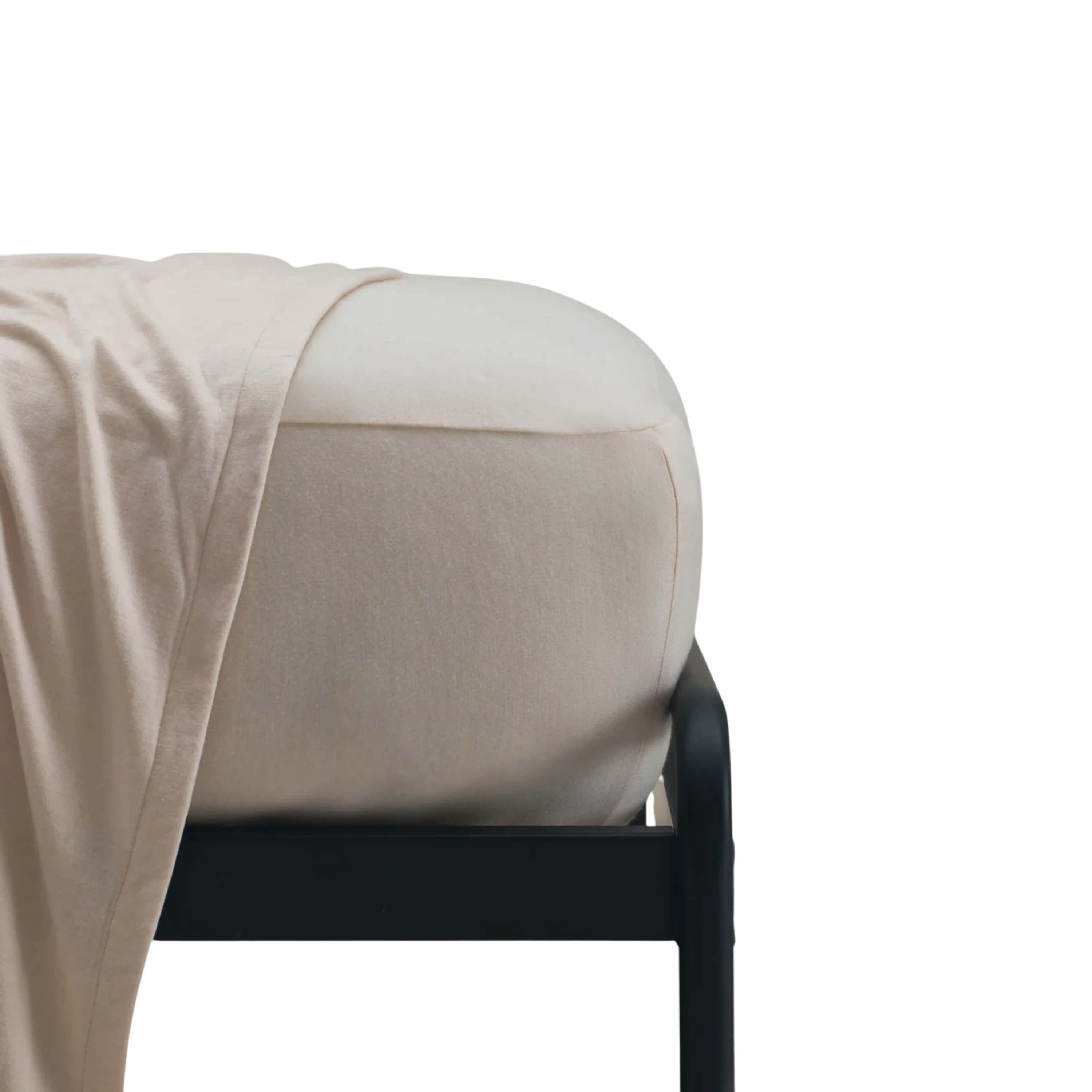 Merino Fit Sheet Queen in Ivory Merino Jersey shown fitted over a mattress with coordinating bedding draped over the edge.