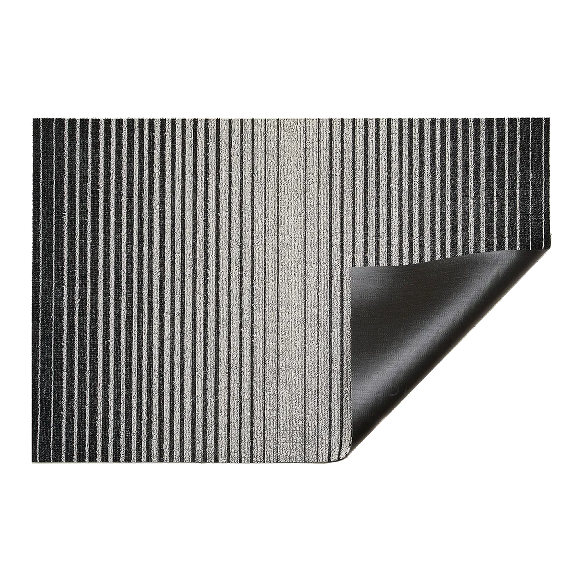 Inspired by the sharp contrast and mesmerizing motion of a cascading row of dominoes, the variegated stripes of this easy-care floor mat are at once dynamic and serene.