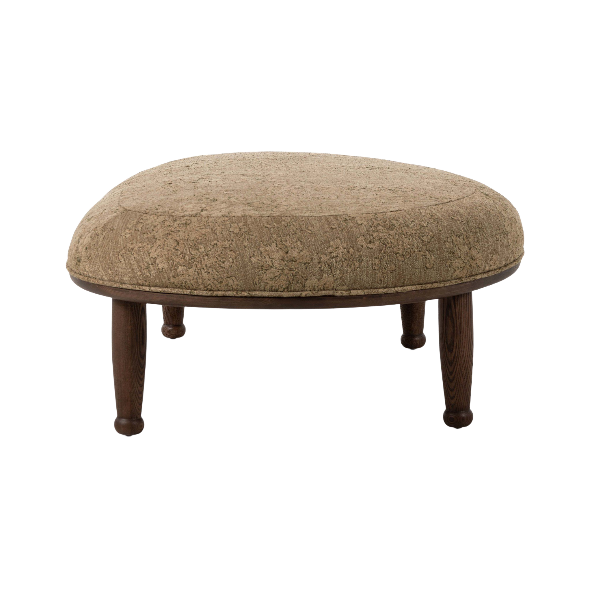 Three-quarter view of the Flora Ottoman, featuring a softly domed oval seat, warm taupe upholstery and contrasting dark wood frame.