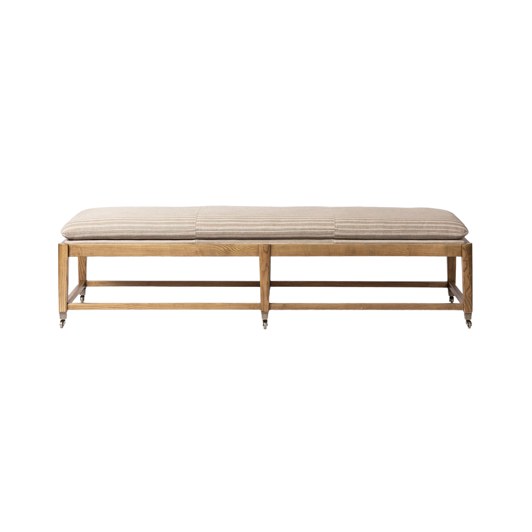 Front view of the Serafina Bench with a long taupe-and-ivory striped cushion, warm wood frame, open stretcher base and antique-style casters.
