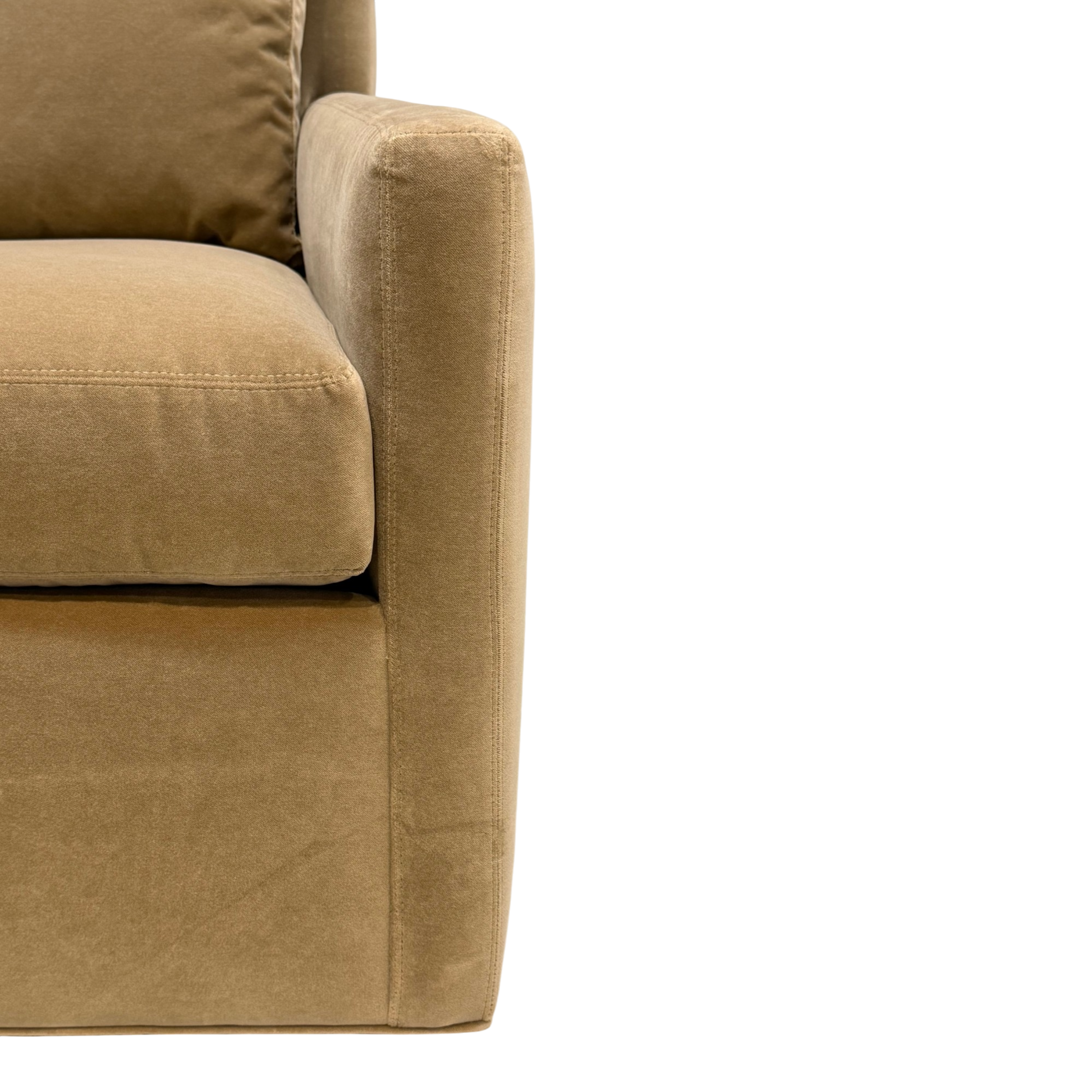 Detail view of the Weston Swivel Chair highlighting the tailored seat cushion, straight upholstered arm and warm caramel-toned fabric.