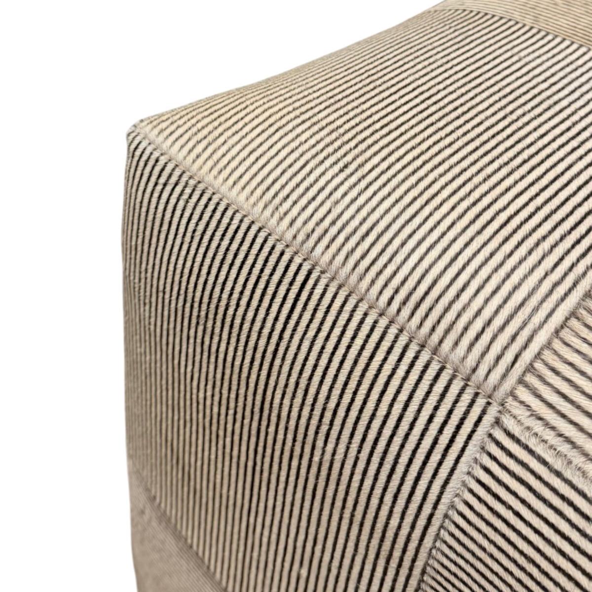 Close-up of Viktor Stool highlighting the cream and charcoal hair-on-hide pinstripes, panel seams and natural texture.