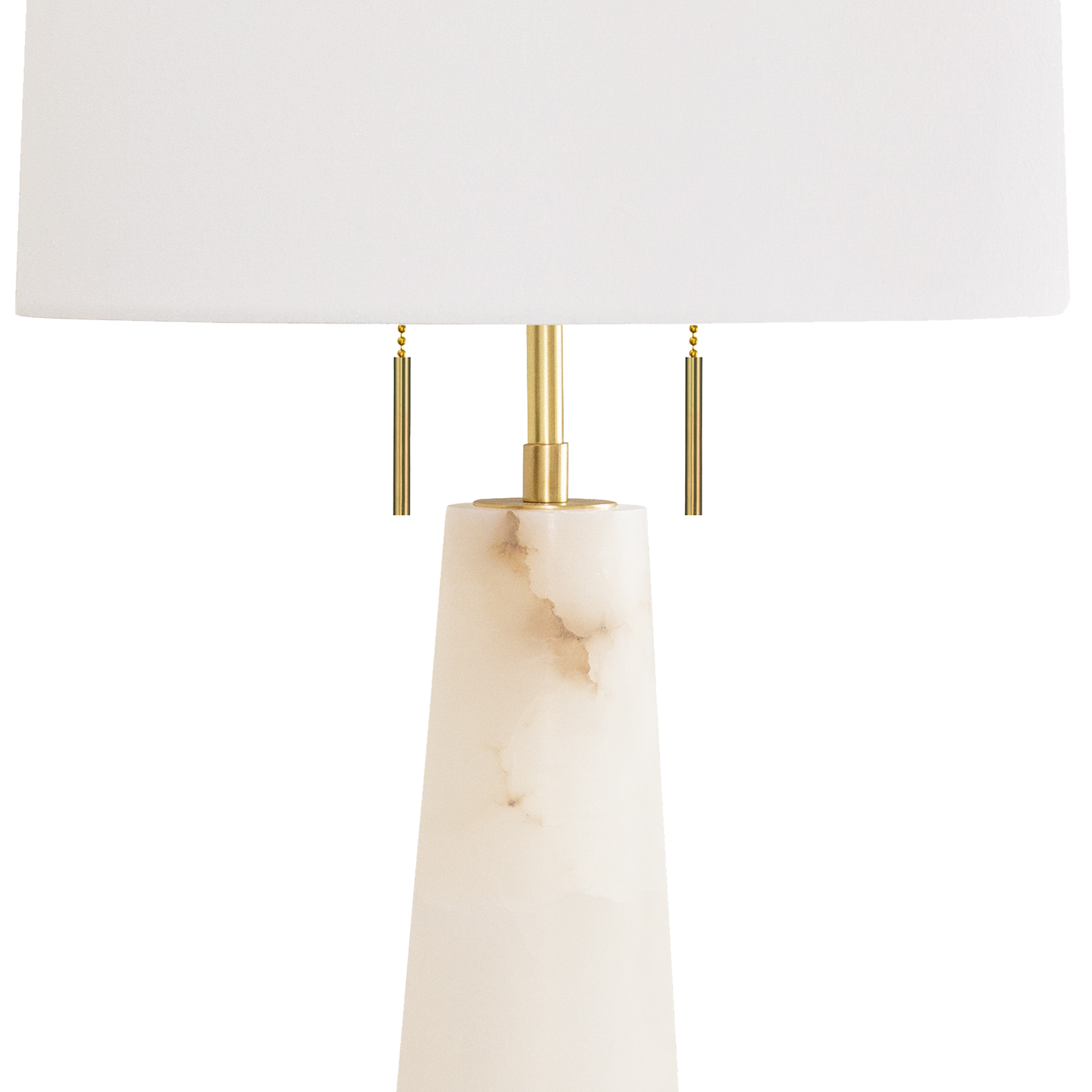 The Austen table lamp combines the classic look of alabaster stone with a modern, conical shape and natural brass finishings, including rectangular switch pulls.