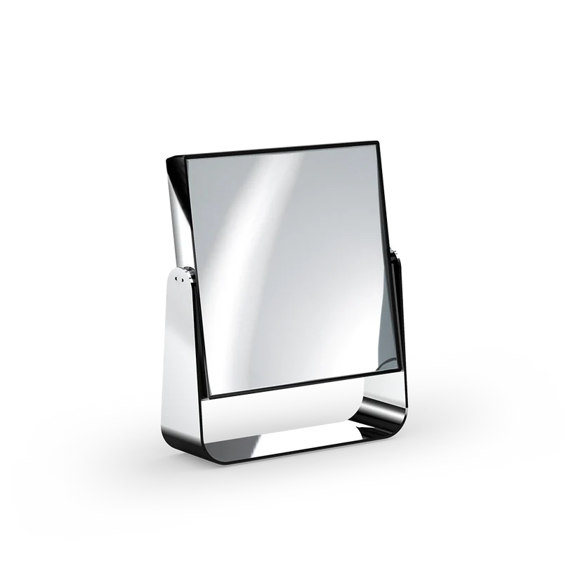 Cosmetic Mirror shown at an angle in chrome polished metal, highlighting the square mirror, slim frame, and curved base.