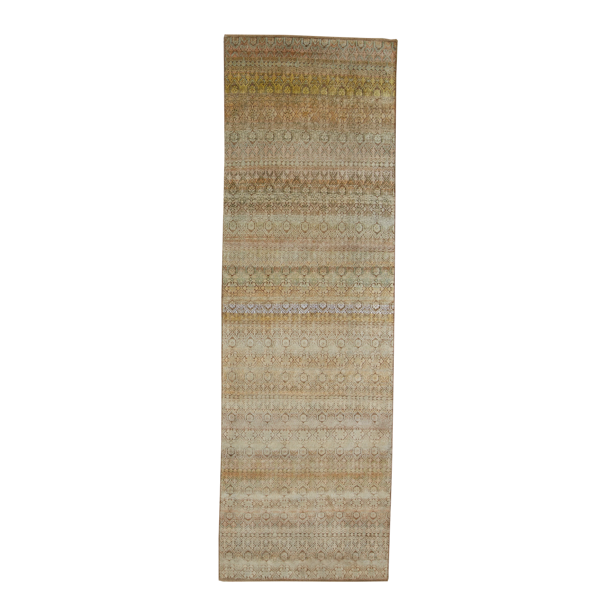A long rectangular area rug with a distressed tribal pattern in shades of beige, brown, muted gold, and light blue, shown flat against a white background.