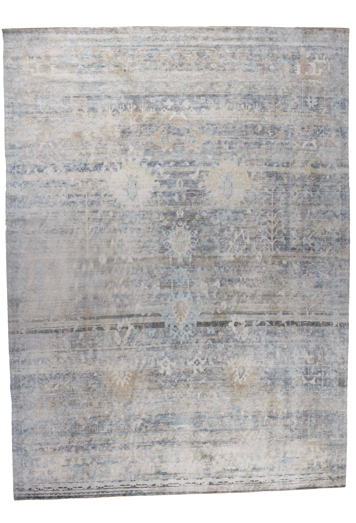 A rectangular area rug with a distressed, vintage-style traditional pattern in muted shades of blue, beige, and gray, shown flat against a white background.
