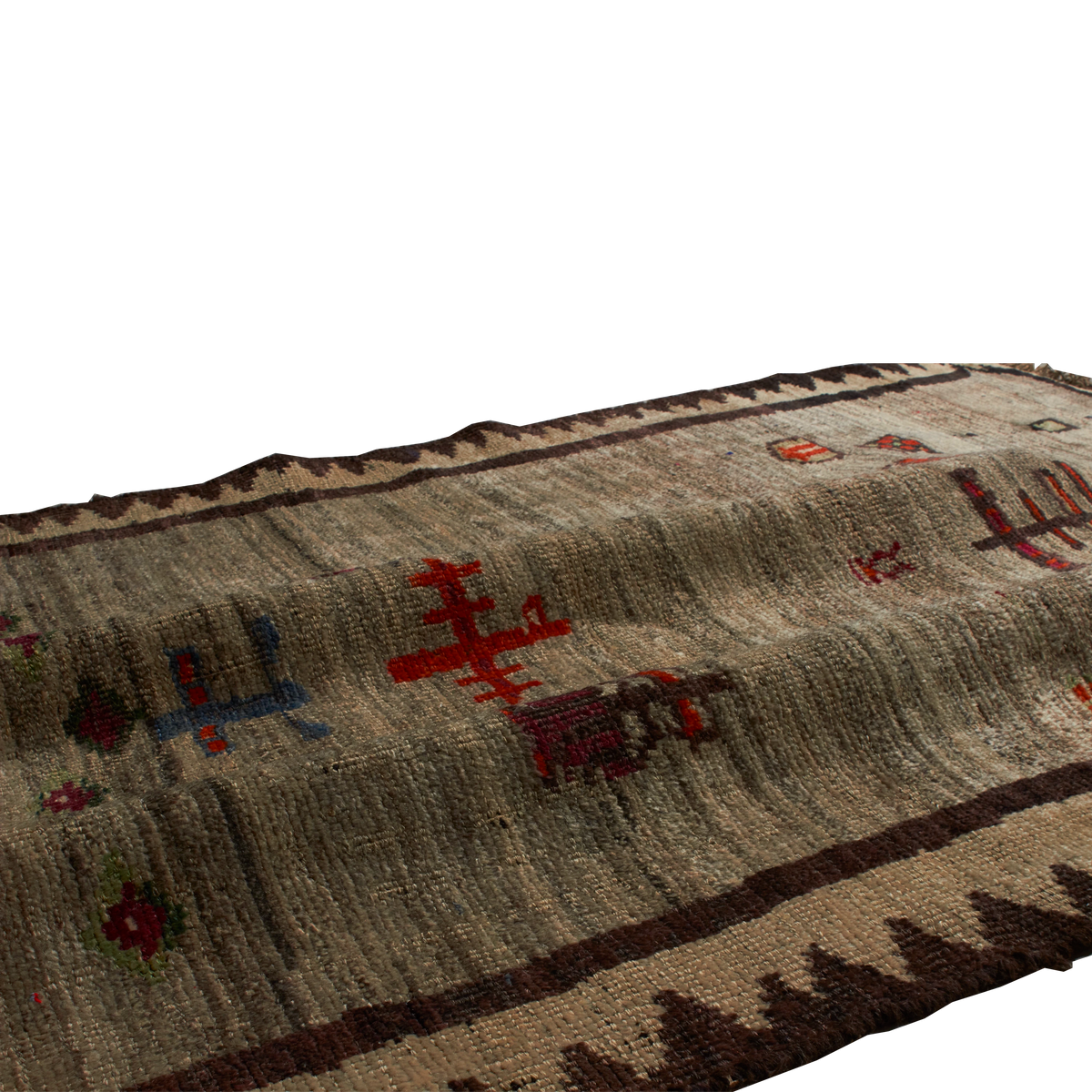 A close-up of a woven rug with a textured beige and brown base, decorated with red, blue, and black geometric and floral motifs.