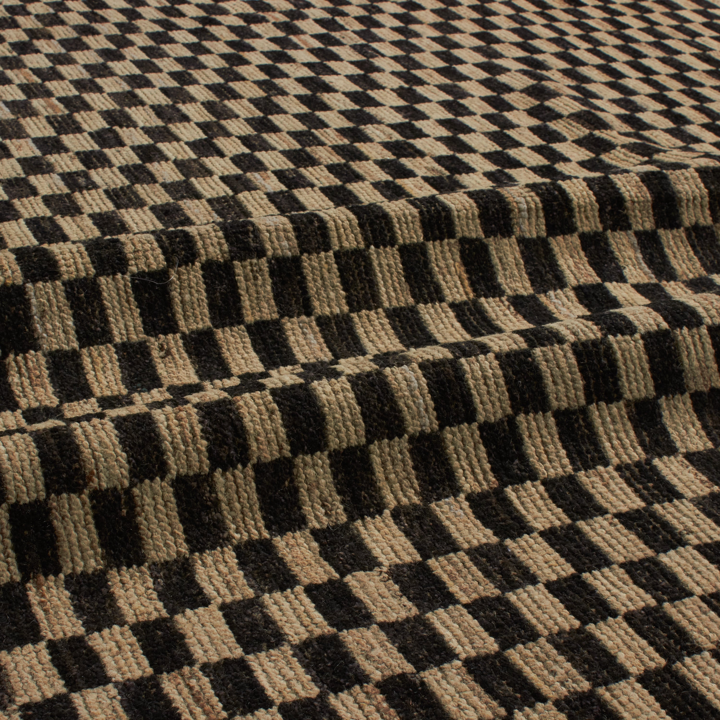 Revered for its lustre and soft hand, the natural qualities of wool from ancient Karakul sheep are honoured through restraint and refinement.