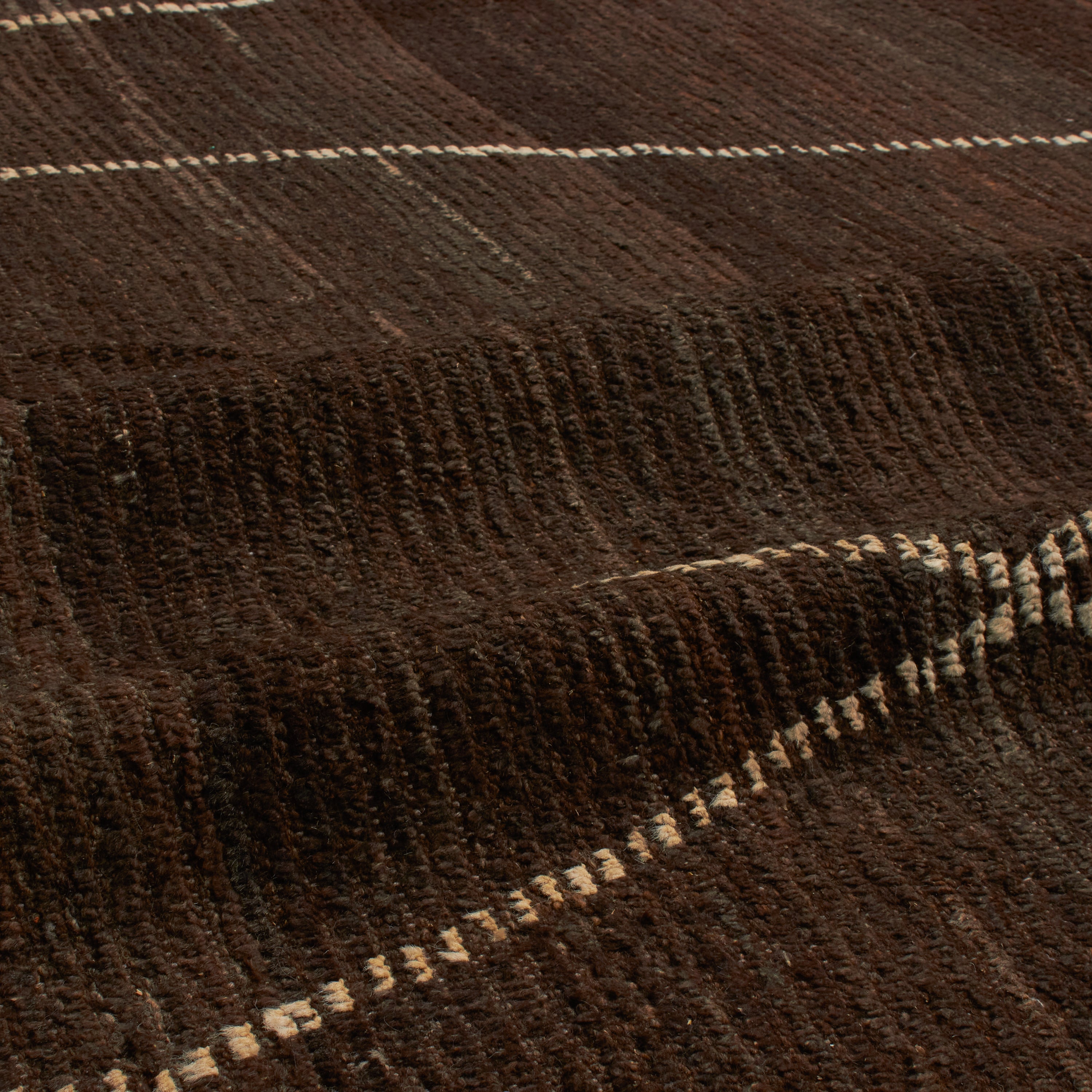Revered for its lustre and soft hand, the natural qualities of wool from ancient Karakul sheep are honoured through restraint and refinement.