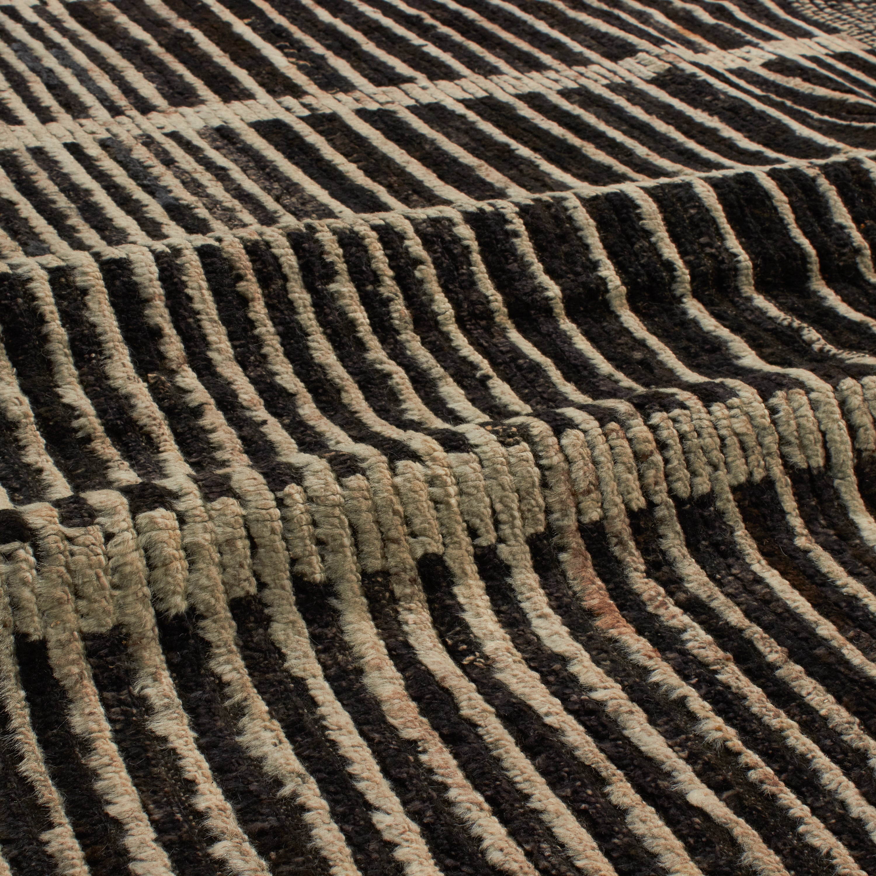 Revered for its lustre and soft hand, the natural qualities of wool from ancient Karakul sheep are honoured through restraint and refinement.