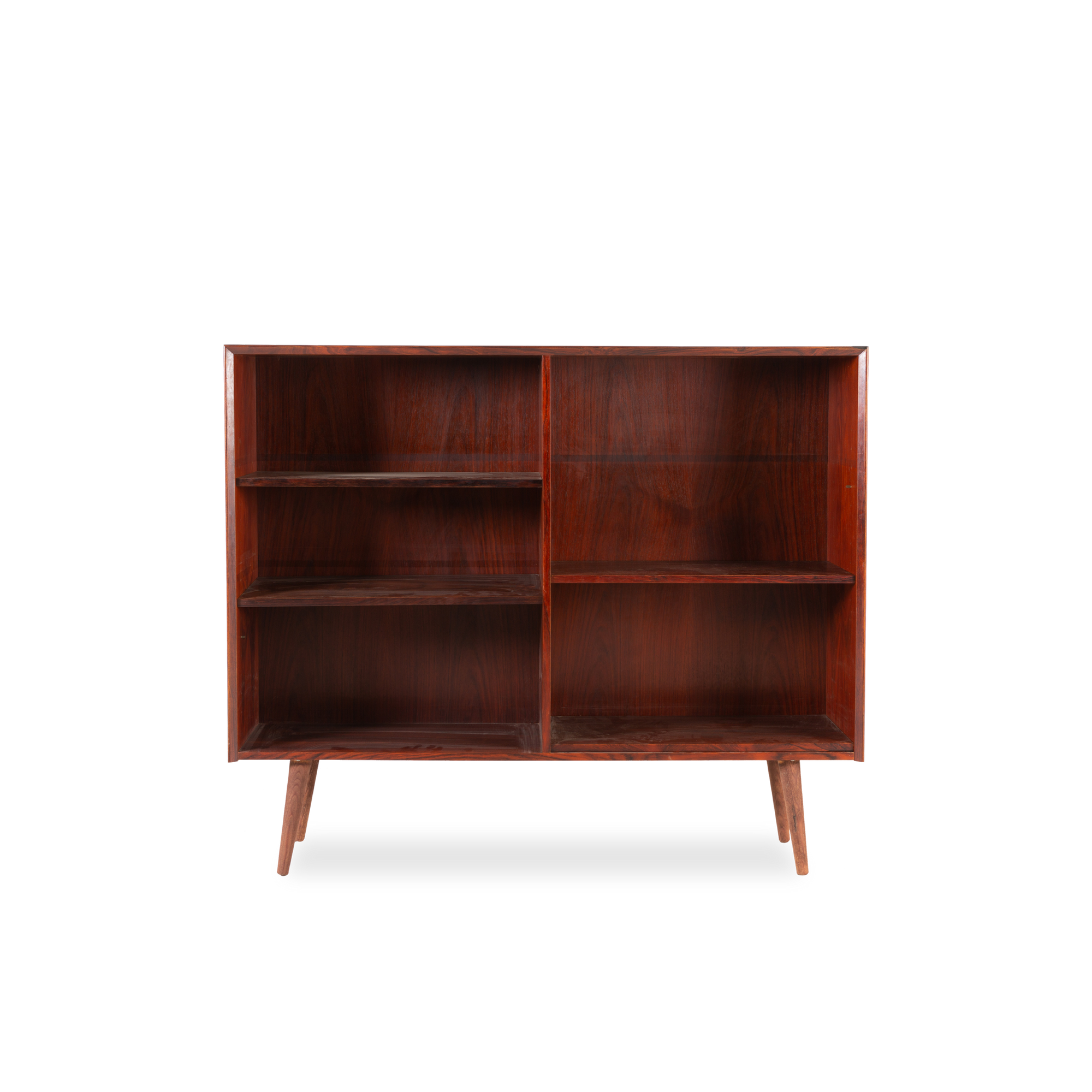 A beautiful display of rich aged rosewood, this vintage bookcase was designed by Erik Brouer for Brouer Mobelfabrik, Denmark.
