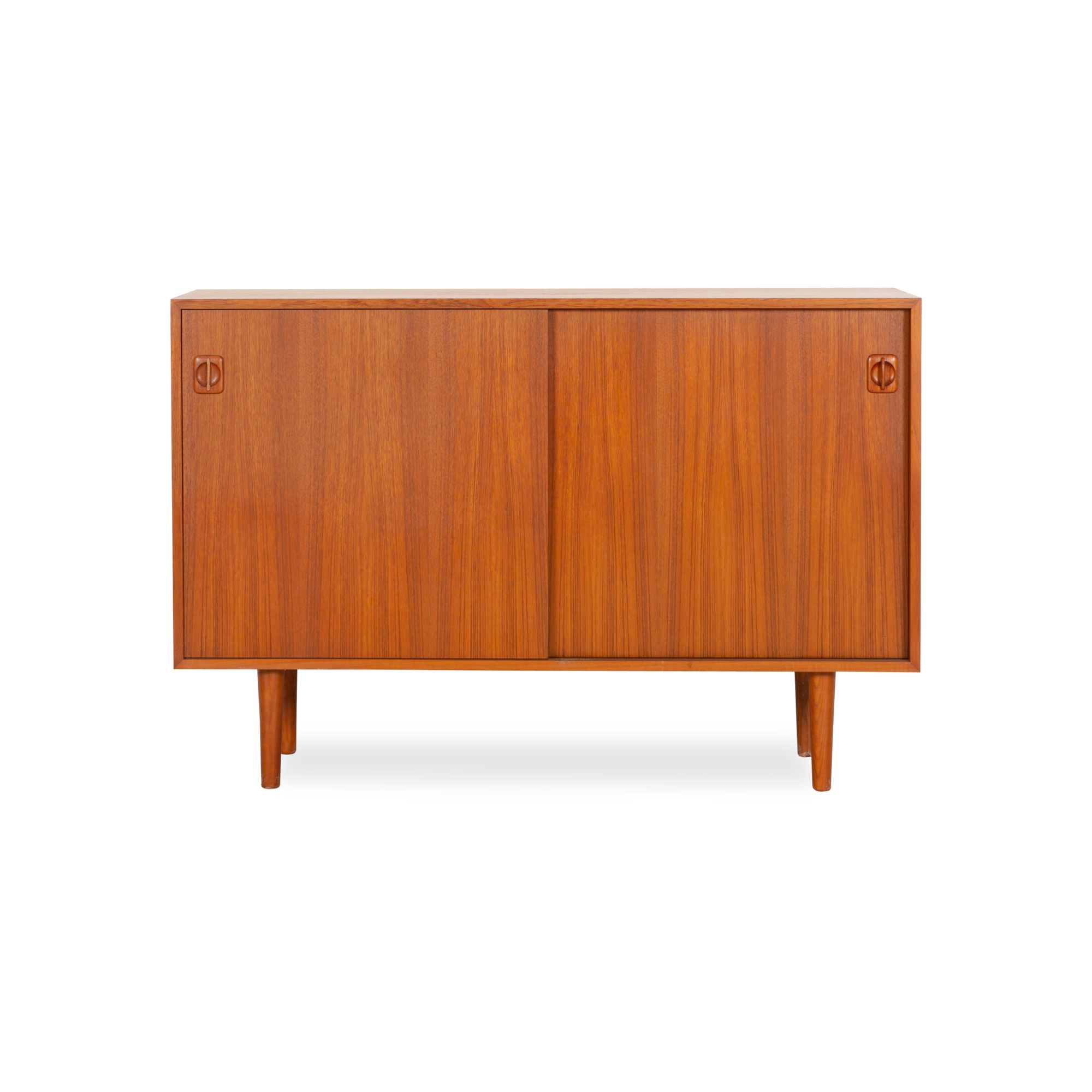 Displaying an elegantly aged teak finish, this vintage sideboard was produced in Denmark, circa 1960s.