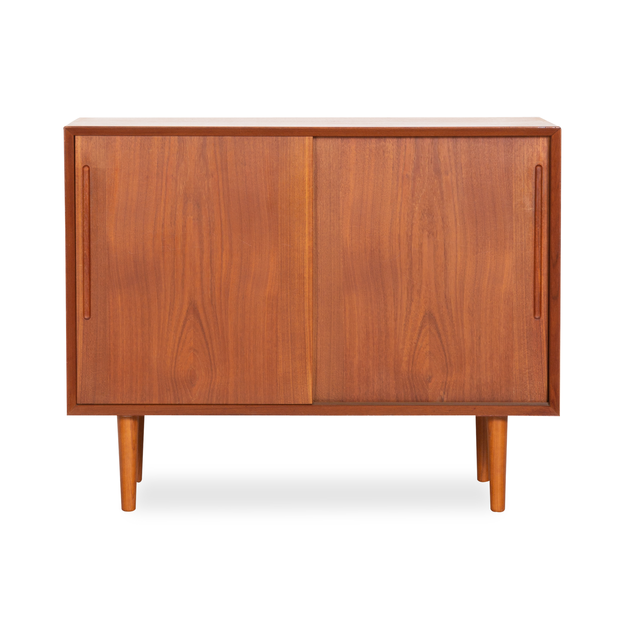 Displaying an elegantly aged teak finish, this vintage cabinet was produced in Denmark, circa 1970s.