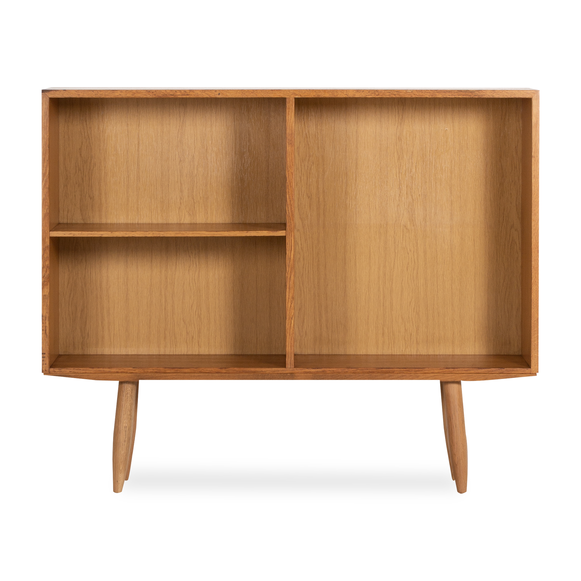 A beautiful display of rich aged rosewood, this vintage oak bookcase was manufactured in Denmark circa 1960s.