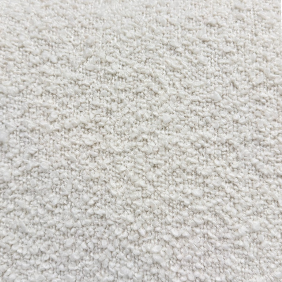 Close-up of Nat Oak ivory upholstery showing the soft boucle-like texture used on the Solenne Swivel Chair.