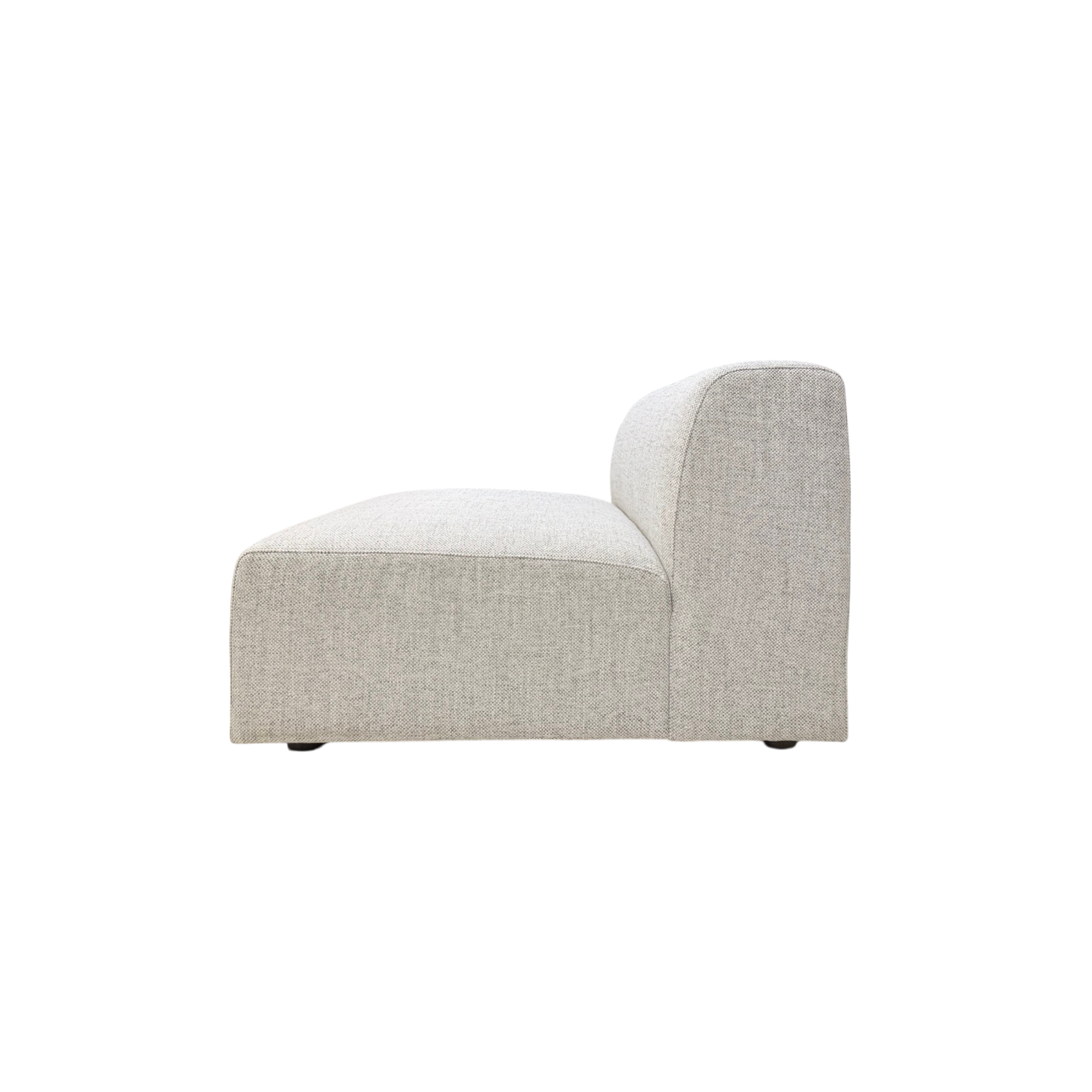 Vetro Bullnose Armless Chair in light woven grey upholstery, side view showing the low wide seat, rounded bullnose front, and upright back.