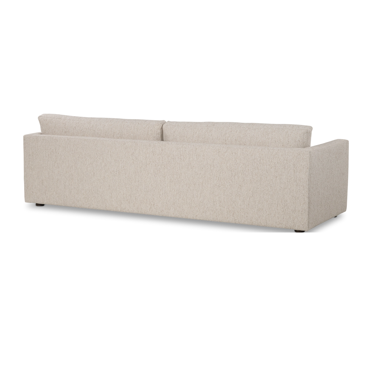 Kore Taper Arm Sofa in Oatmeal textured fabric shown from an angled rear view, with a smooth upholstered back panel, loose back cushions, and dark feet.