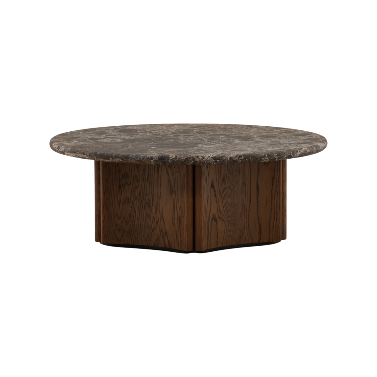 Aldridge Coffee Table shown from an alternate angle, featuring its circular marble top and substantial faceted wood pedestal base.