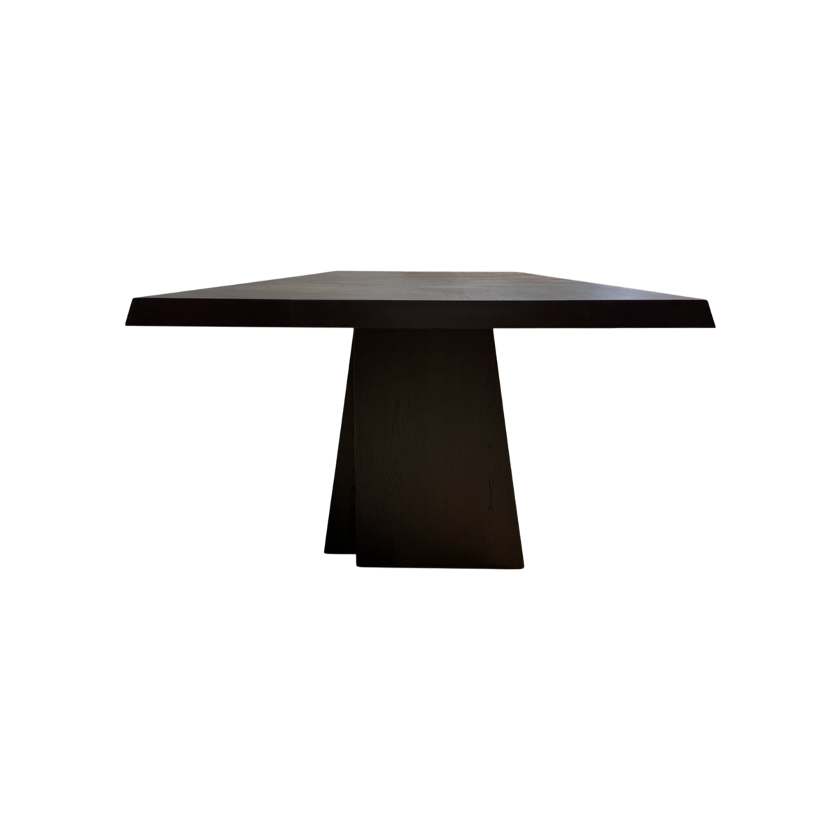 Side view of the Oblique 96-inch Dining Table highlighting the substantial tabletop and architectural tapered pedestal base.