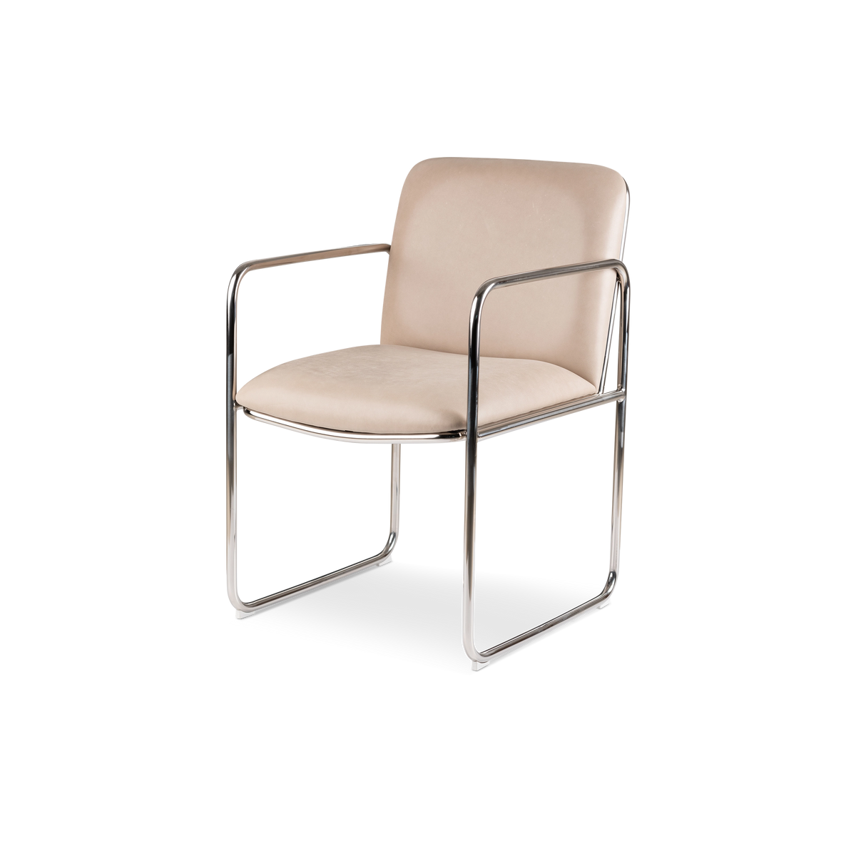 Rhodes Arm Chair angled from the front in taupe leather and polished stainless steel, highlighting the curved back, slim tubular arms, and open sled base