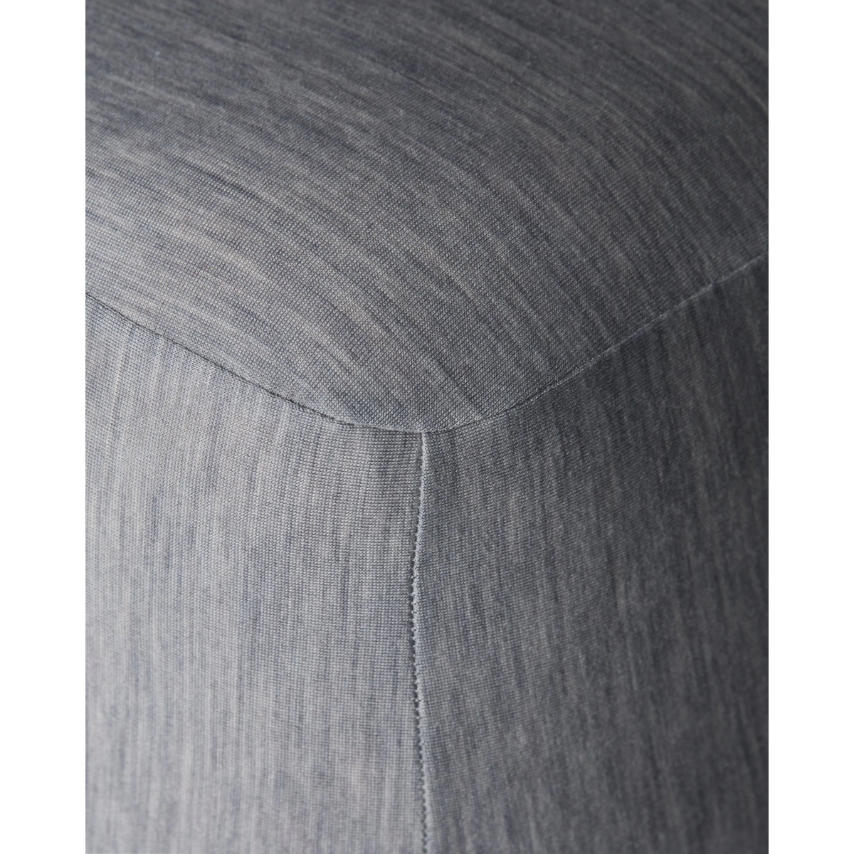 Close-up of Merino Fit Sheet King in Granite grey showing the smooth jersey texture, fitted corner and tailored seam detail.