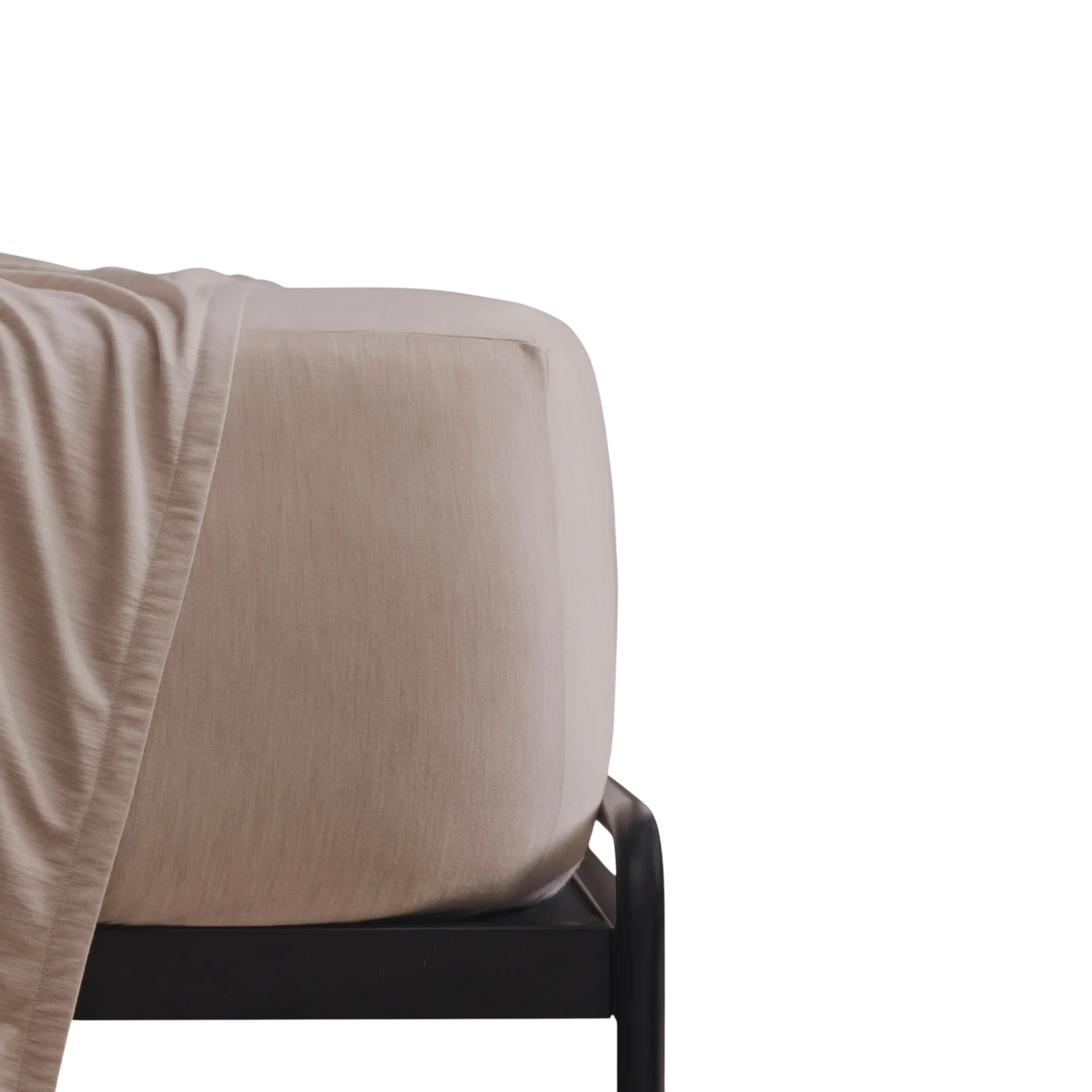 Merino Fit Sheet King in Sand Merino Jersey shown fitted over a mattress with coordinating bedding draped over the edge.