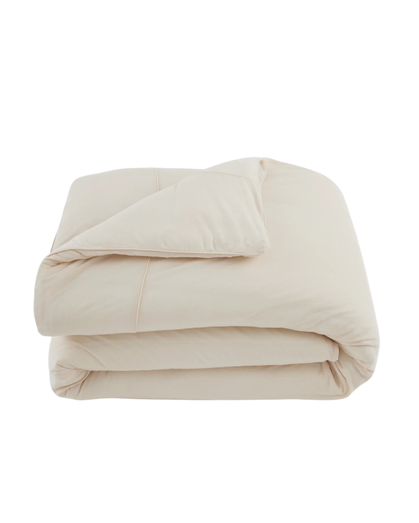 Merino Duvet Cover Queen Ivory, folded ivory merino wool and bamboo jersey duvet cover with soft drape, tailored stitching and self-fabric piping.