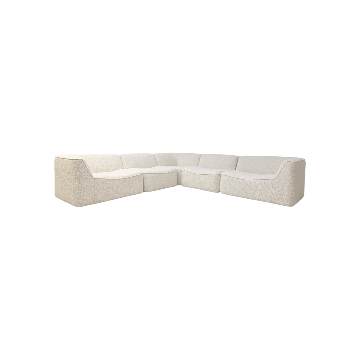 Bento Modular Sectional in ivory bouclé, angled front view showing a sculptural U-shaped configuration with softly curved seats, rounded corners, and a continuous low back.