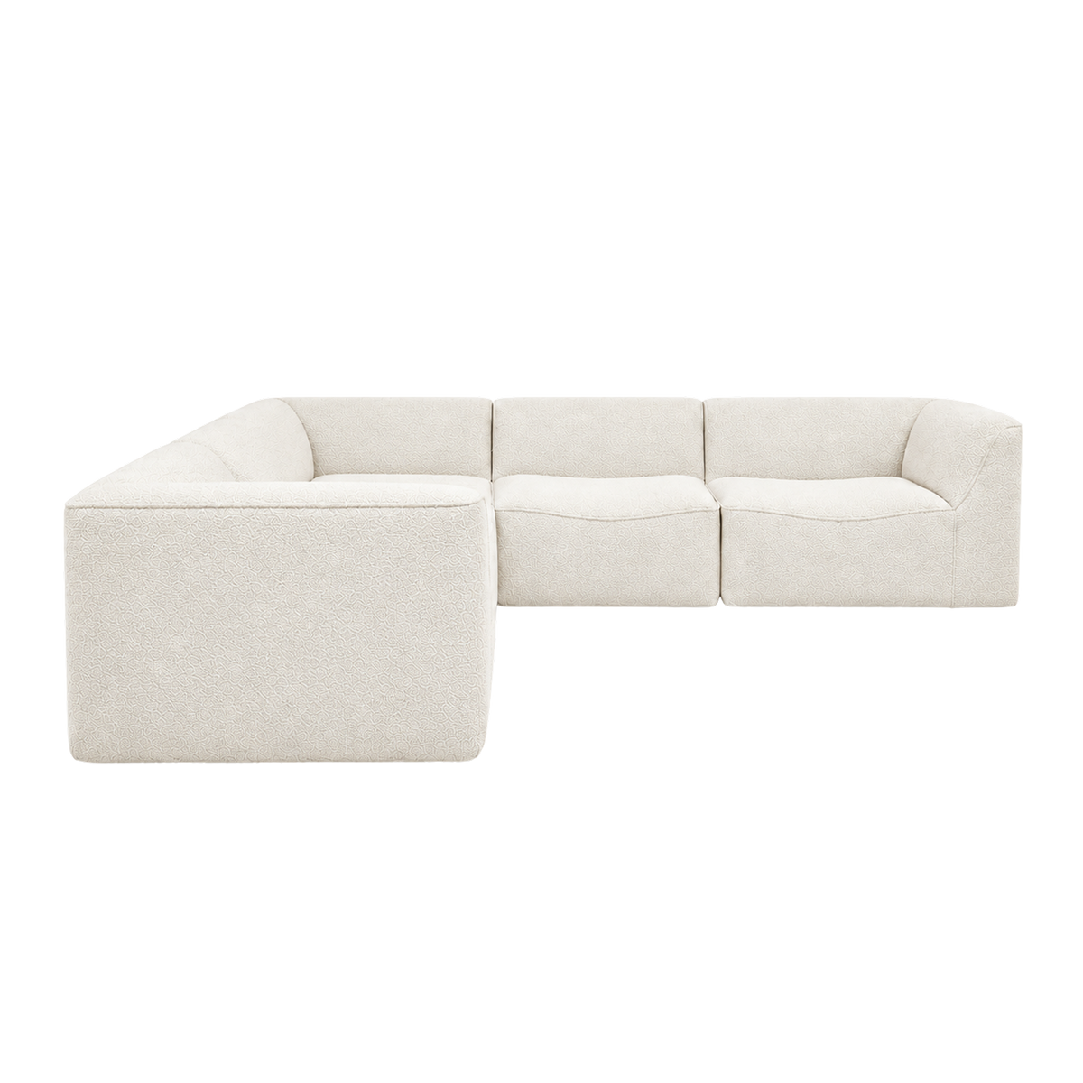 Bento Modular Sectional shown from the side in ivory bouclé, with an L-shaped layout, a wide rounded side panel in the foreground and a sloped arm at the far right.