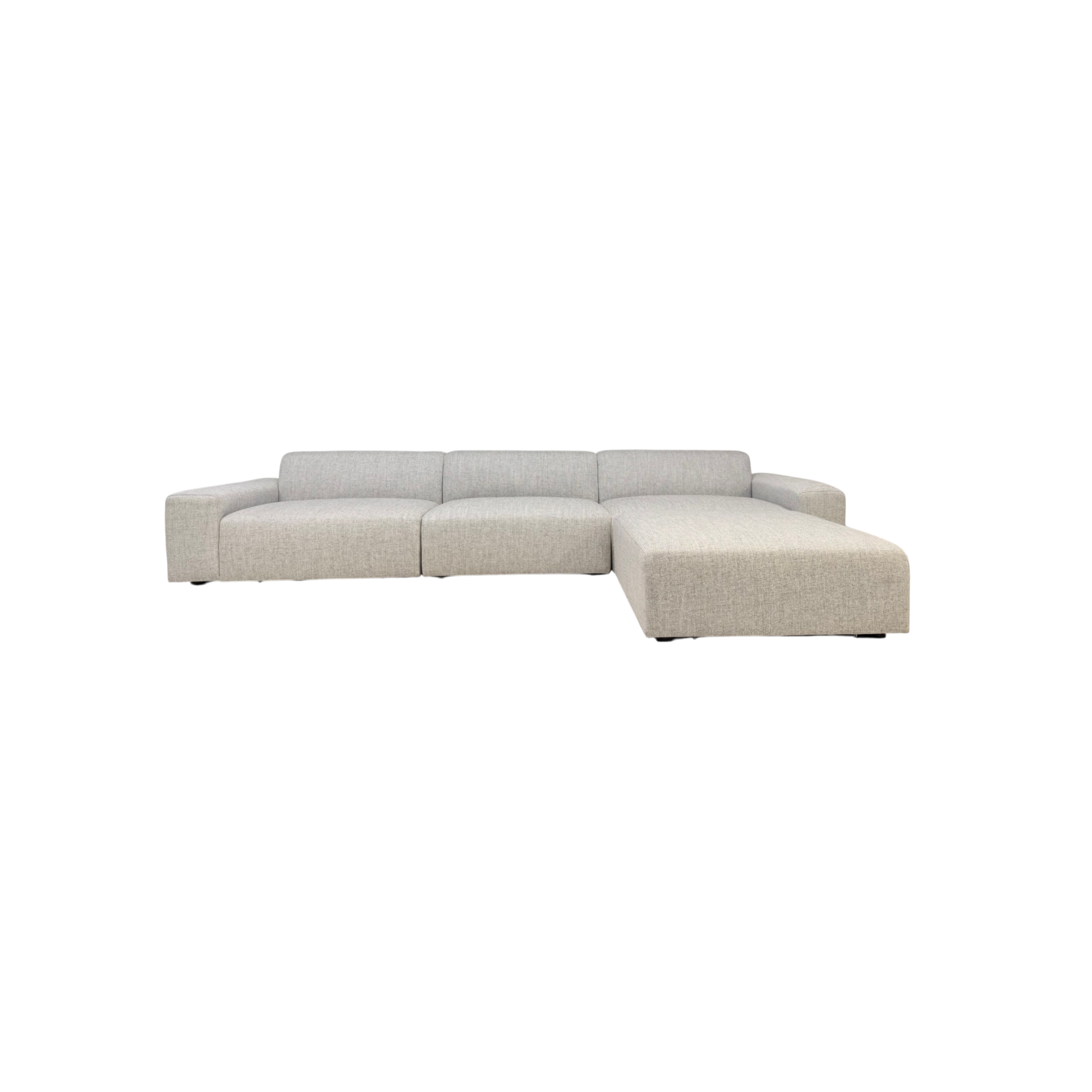 Vetro Bullnose Sectional in light woven grey upholstery, front view showing the low-profile modular configuration with right-side chaise.