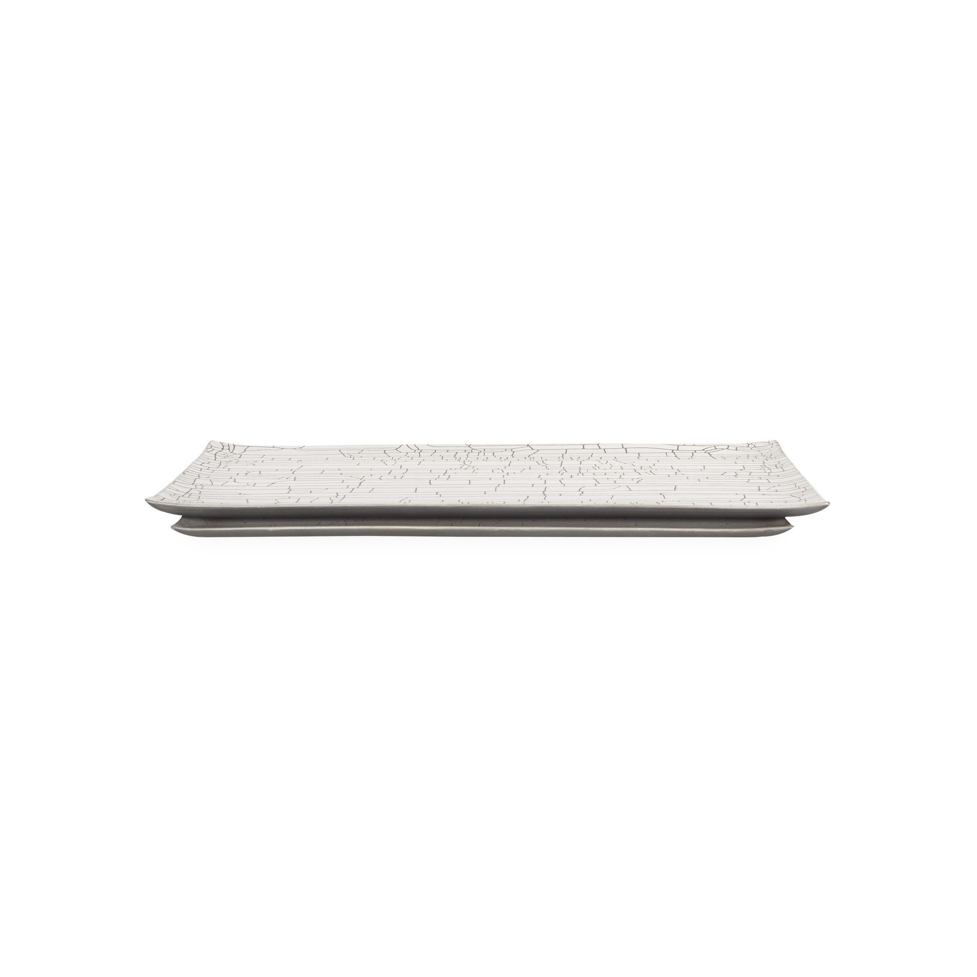 Defined by its intricate white crackle finish, the Rectangular Crackle Tray features a low rectangular silhouette and soft, rounded corners which allow this piece to effortlessly b