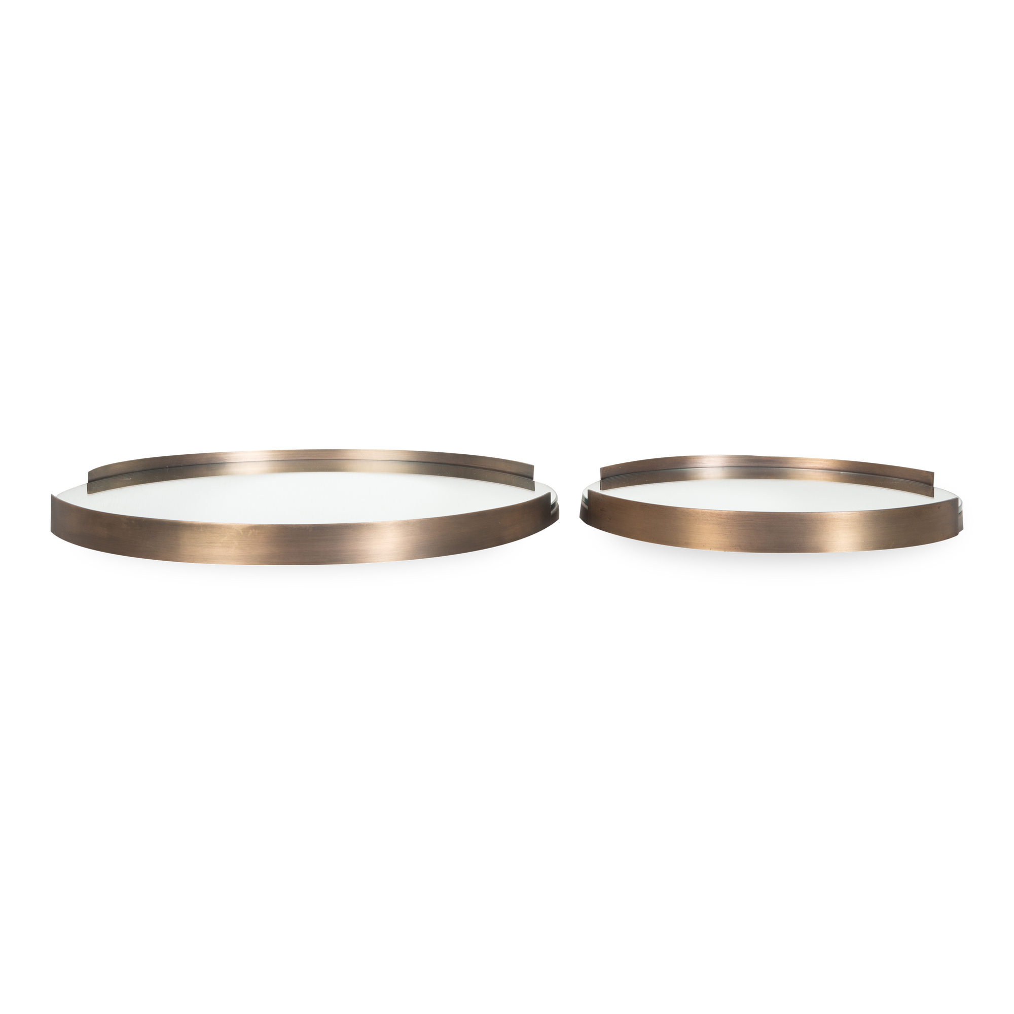 The Eve Round Tray is crafted from iron in a sleek antique brass finish.